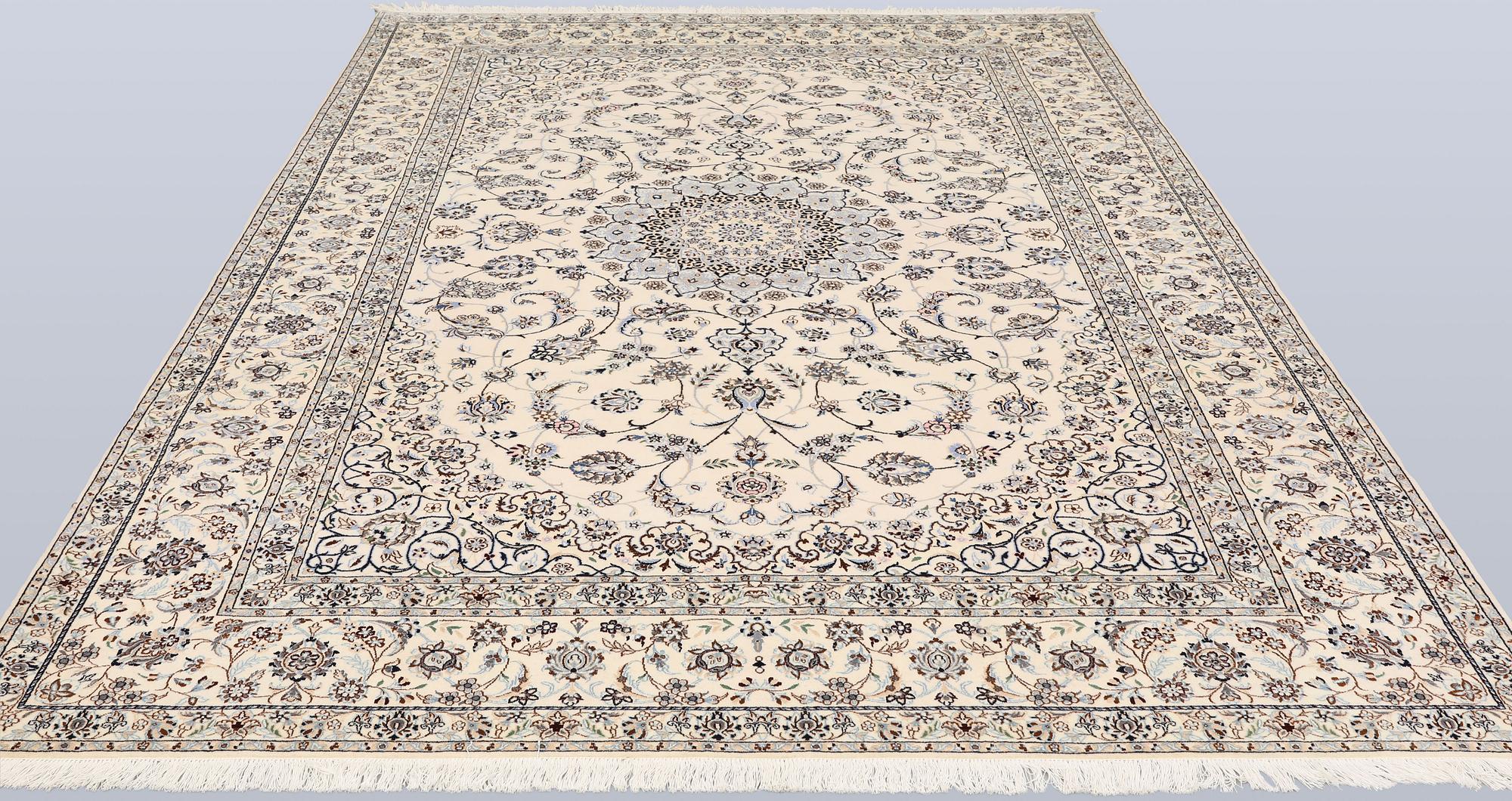 A Nain, part silk carpet, 305 x 207 cm.