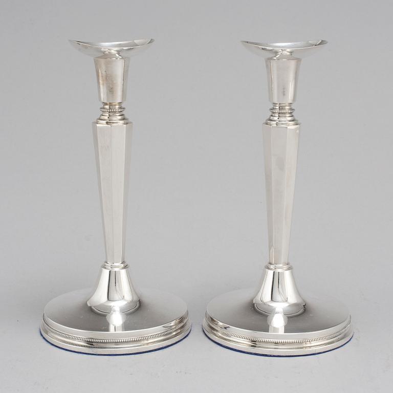 A pair of silver candle sticks by Eric Löfman, Uppsala 1961.