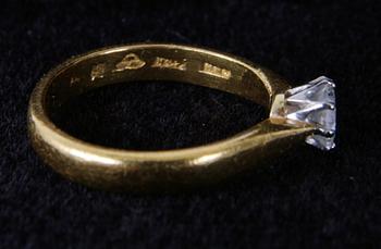 RING, 23K guld med briljant ca 0,25ct.