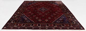 An oriental rug, c. 365 x 285 cm.