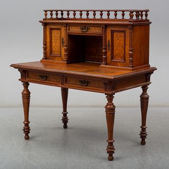 A late 19th century writing desk and armchair.