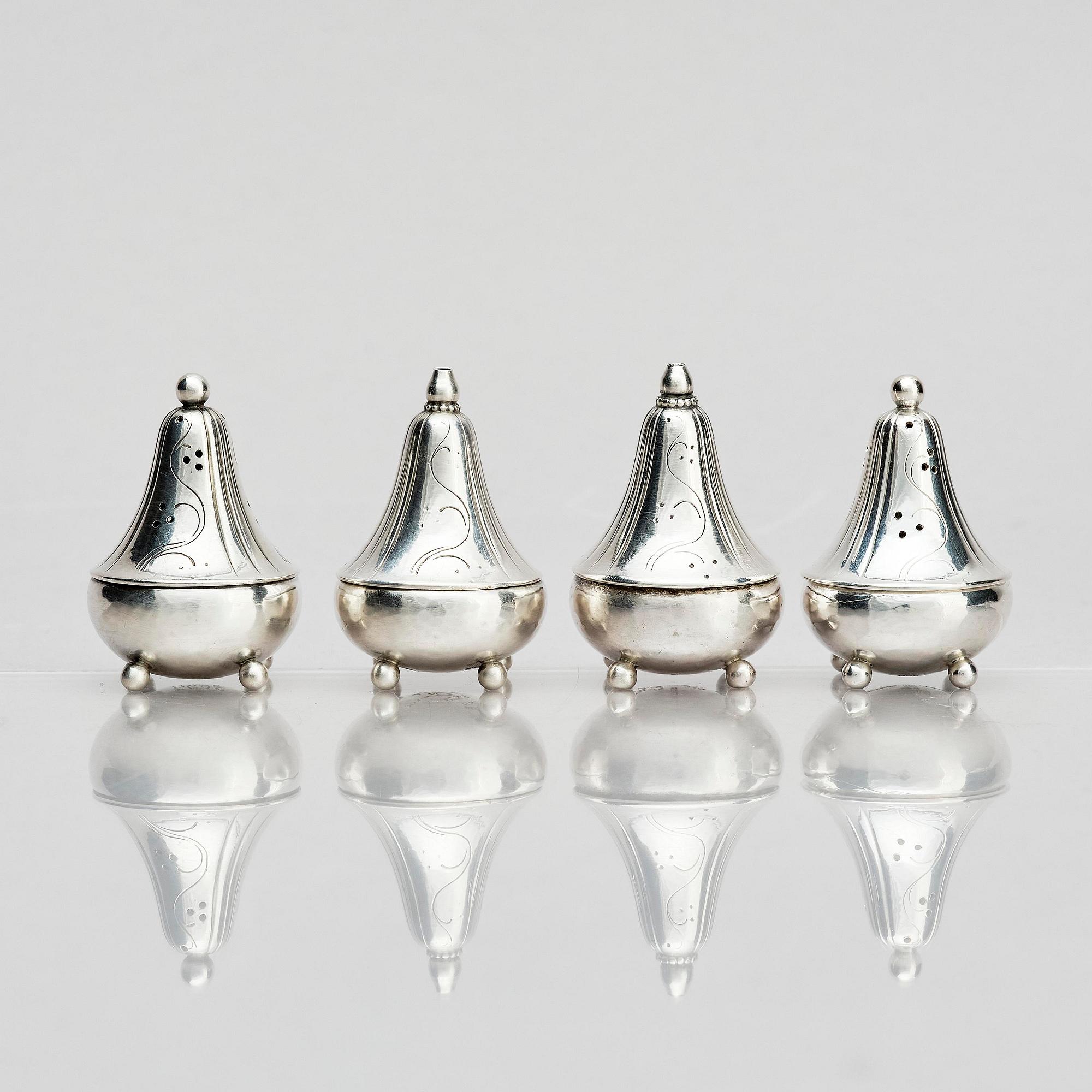 Georg Jensen, four sterling silver casters, design Harald Nilesen, Copenhagen 1933-44, one Copenhagen after 1945.