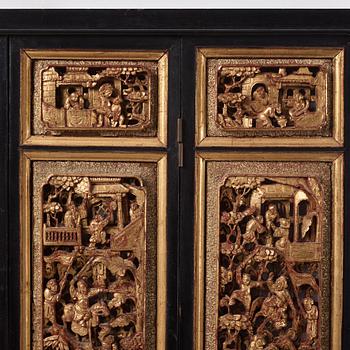 A set of four framed wooden panels, Qing dynasty, 19th Century.