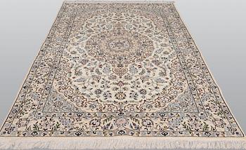 A Nain part silk carpet, 254 x 156 cm.