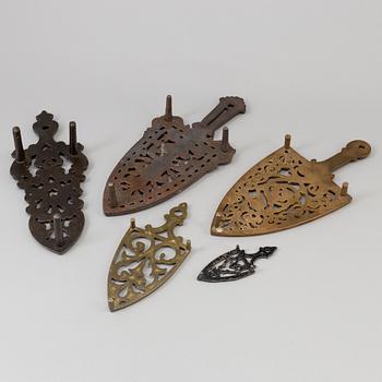 A set of five iron stands, circa 1900.