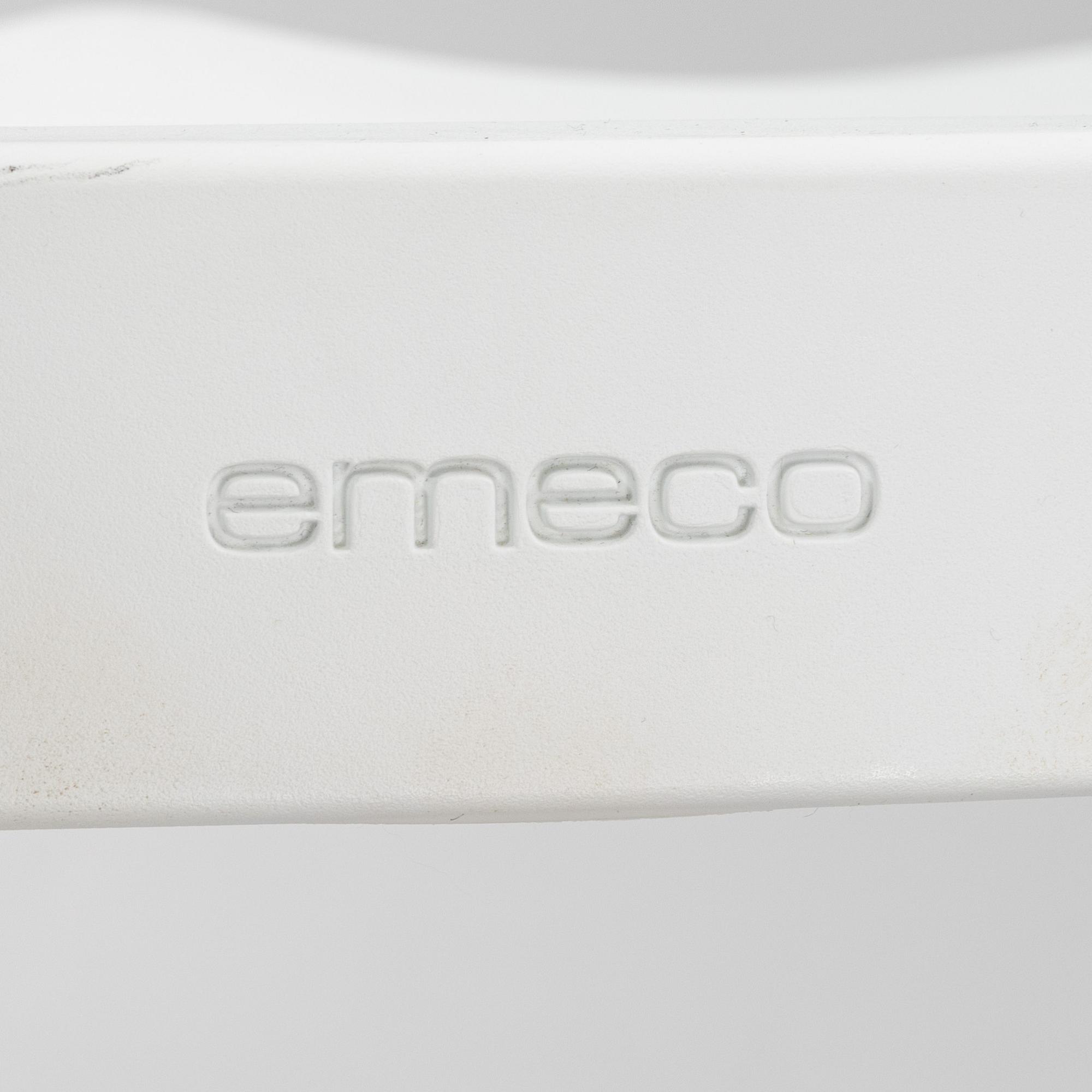 A pair of plastic 'Navy Chair' by Emeco.