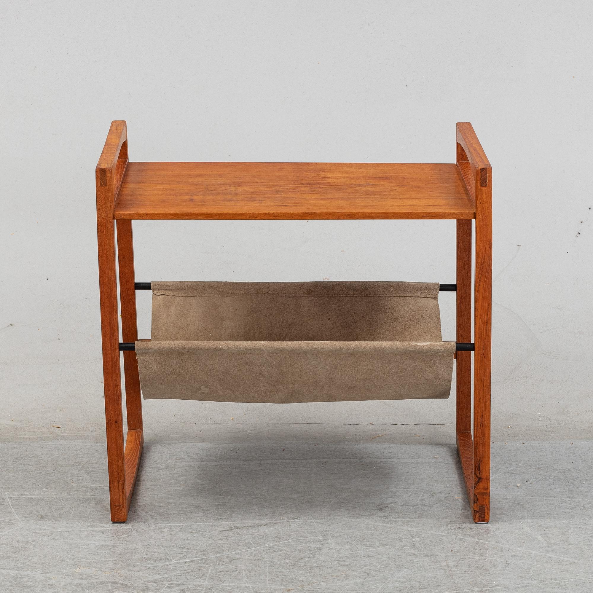 Kai Kristiansen, a teak and suede table.  Sika Møbler, Denmark.