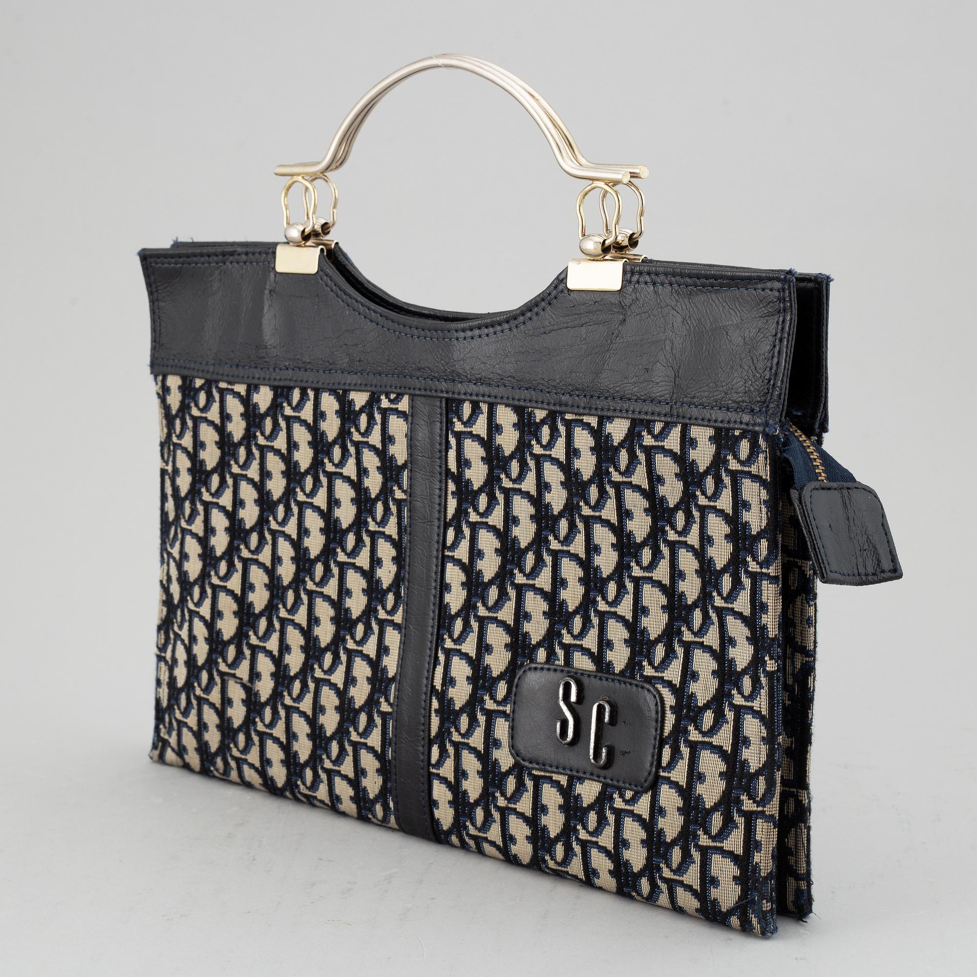 CHRISTIAN DIOR, a monogram canvas handbag.