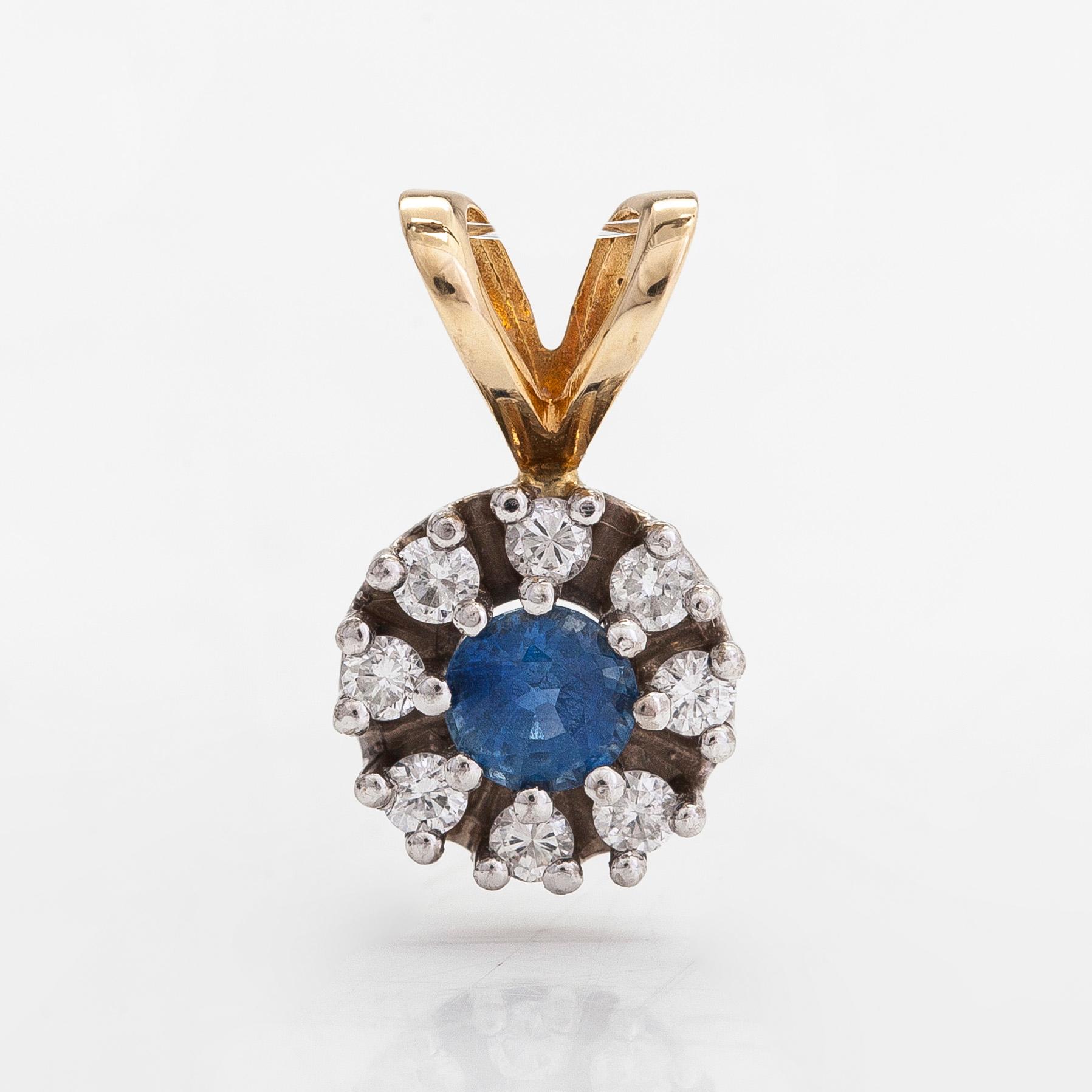 A 14K gold pendant with sapphire and diamonds approx. 0.20 ct in total.