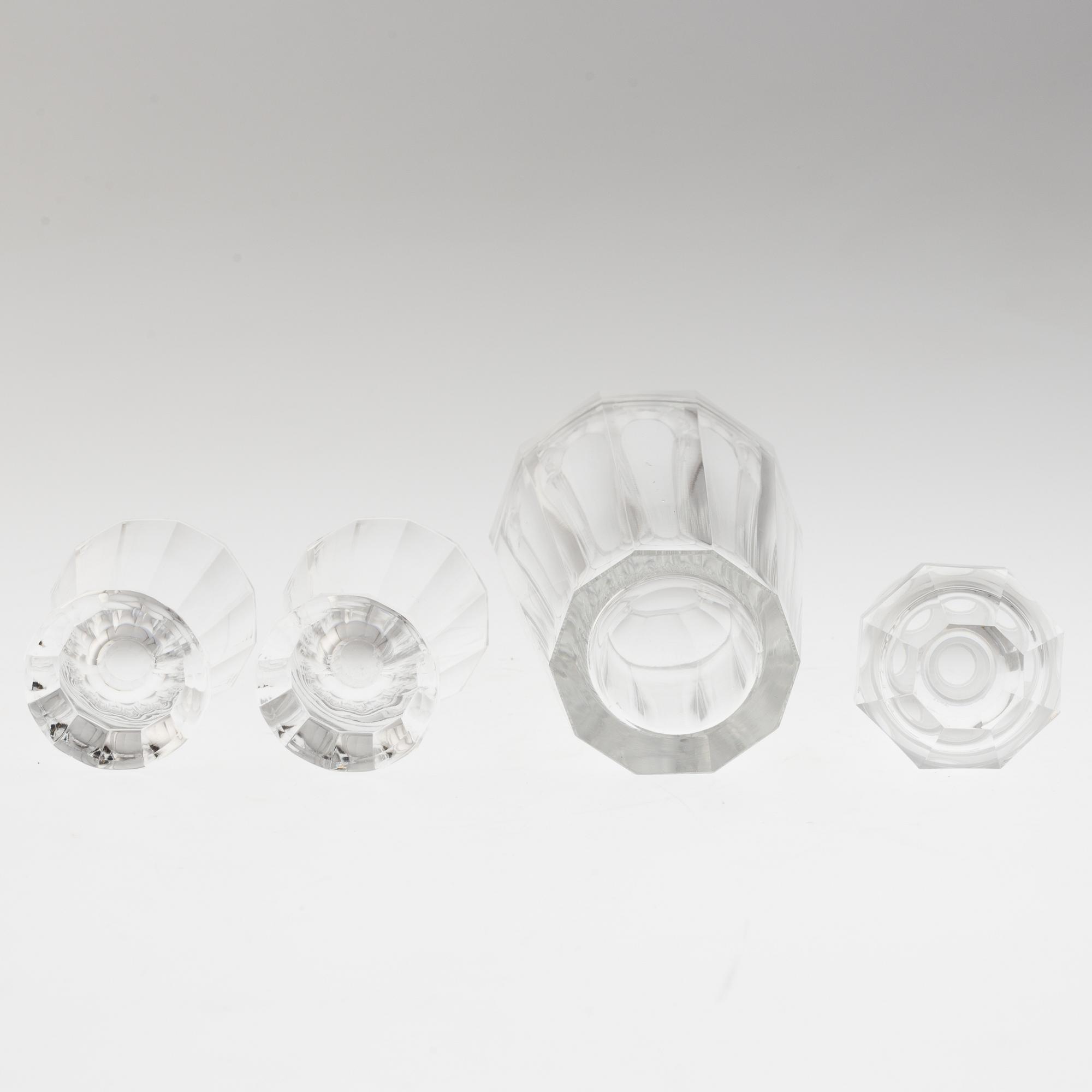 A set of twelve glasses and a cocktailshaker by Elis Berg, Kosta.