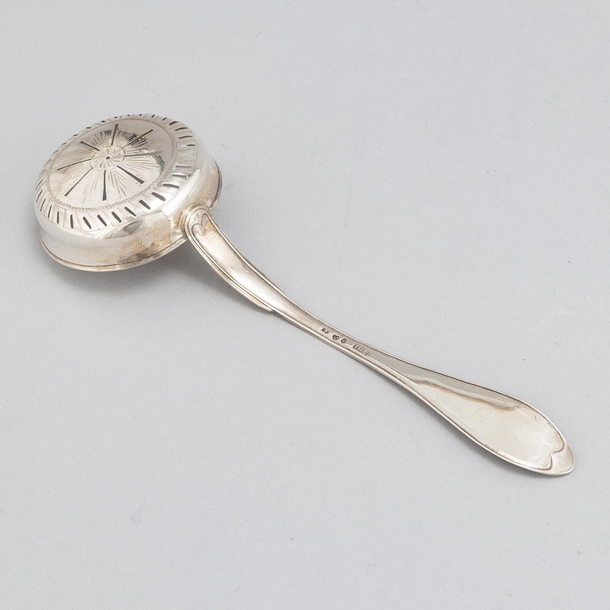 A Swedish 18th / 19th century silver beaker, cup and caster-spoon.