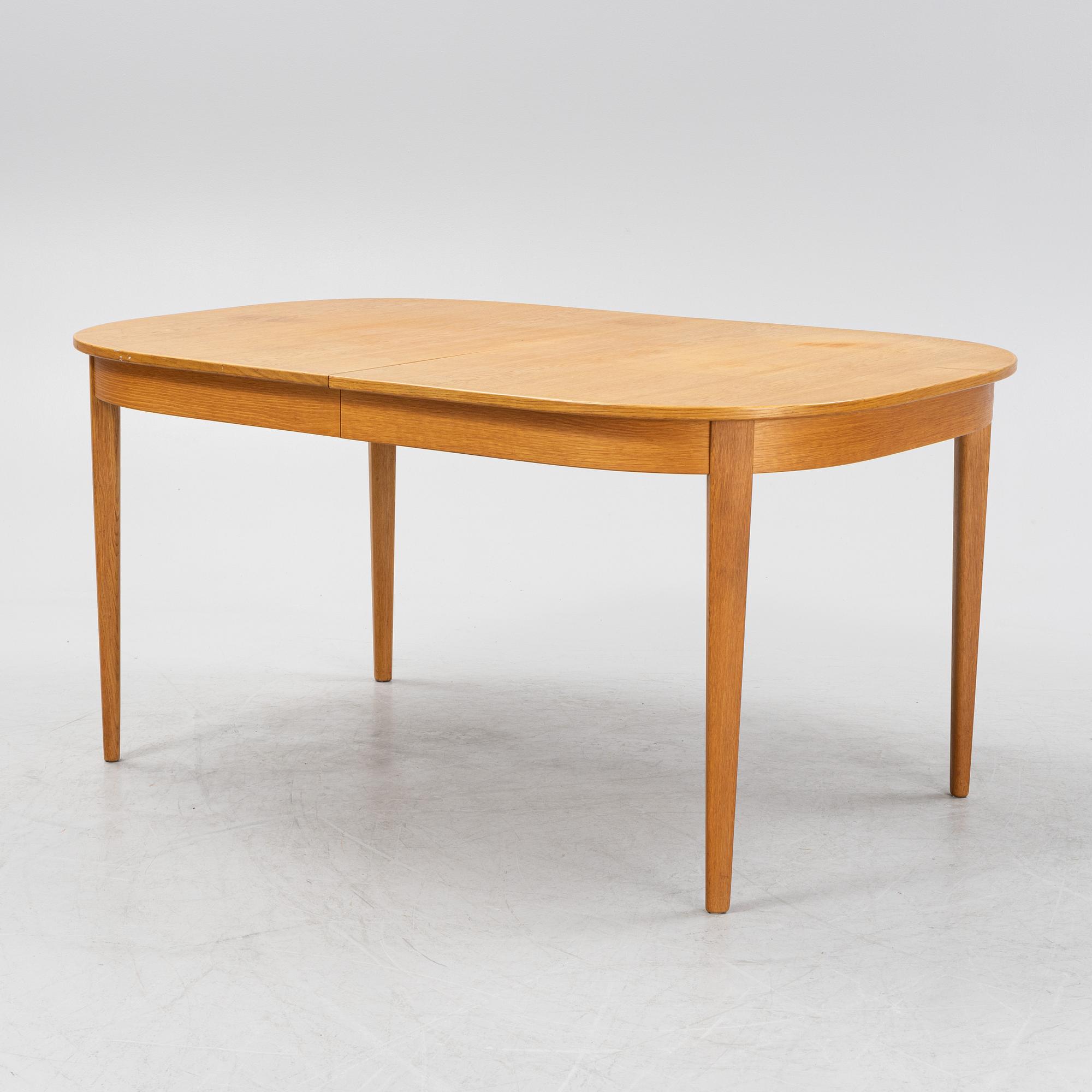 Carl Malmsten, a dining table and four chairs, 'Calmare nyckel', Åfors Möbelfabrik, second half of the 20th century.