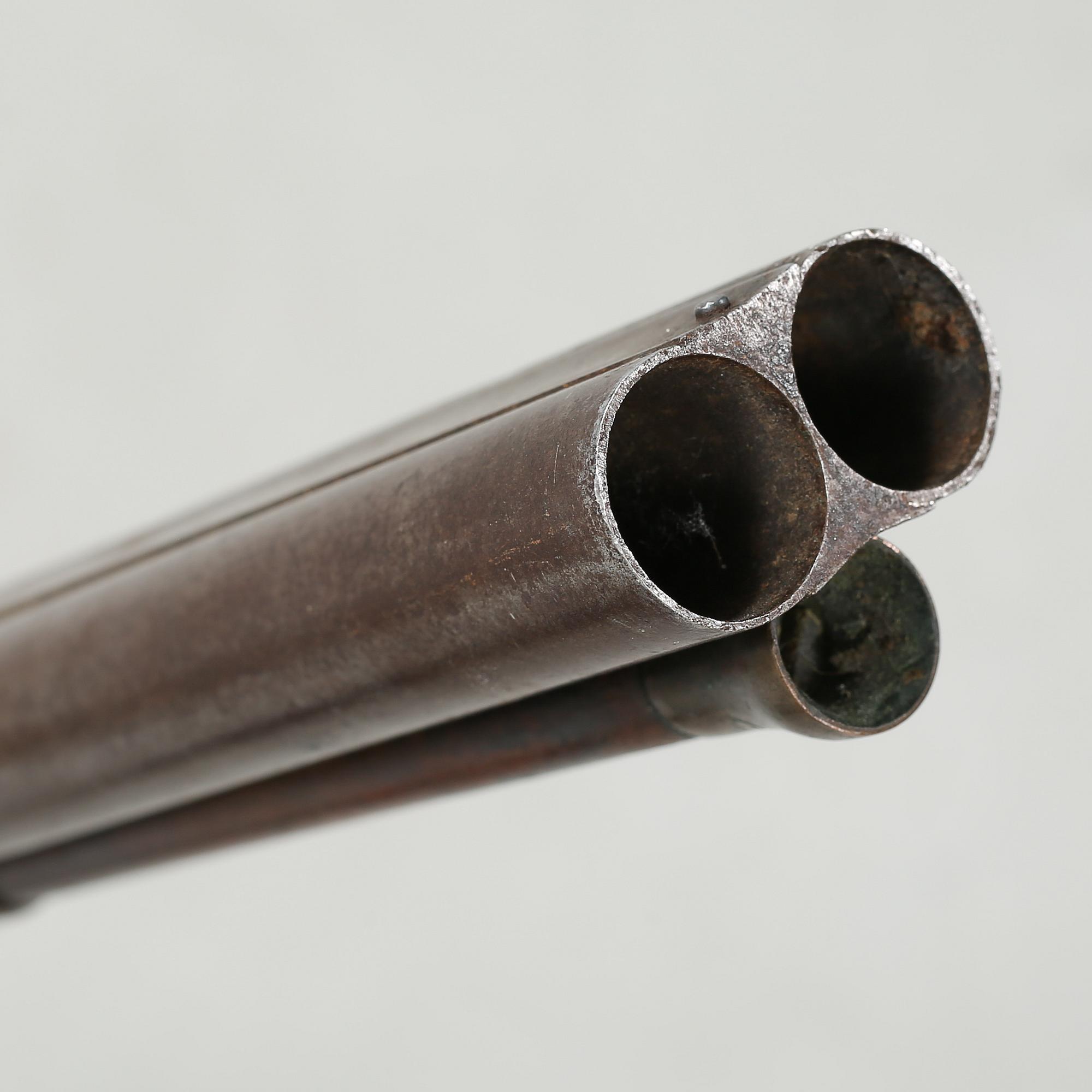 A percussion rifle by Charles William Lanchester in London, around the mid 19th century.