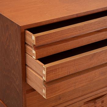 A 1960's teak shelving system by Poul Cadovius.