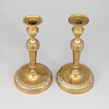 A pair of bronze candlesticks, first half of the 19th century.