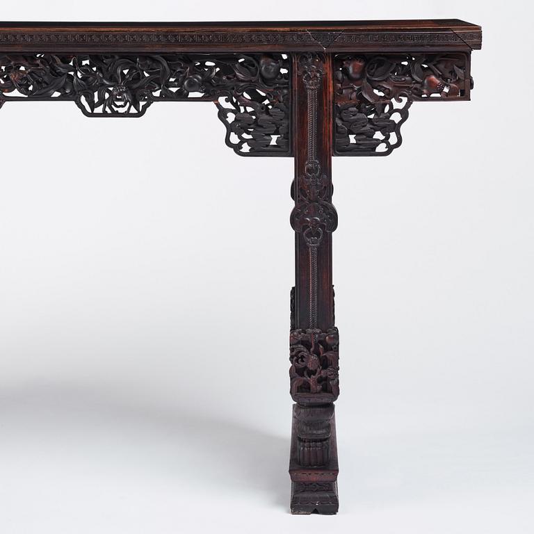 A massive zitan recessed-leg long table 'Jiaotousun Qiotouan', Qing dynasty, 19th century.