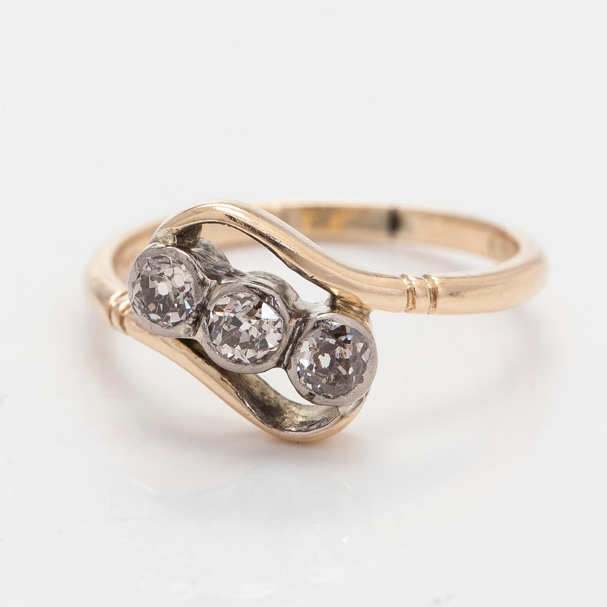 A 14K gold ring with old-cut diamonds.
