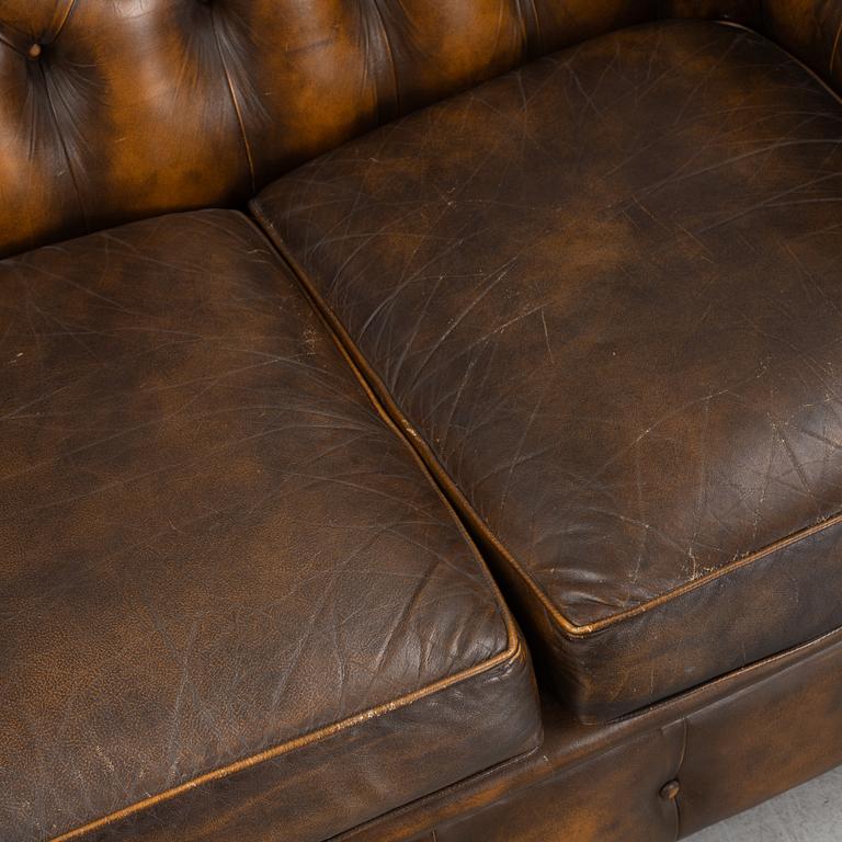 A leather upholstered Chesterfield sofa, England, second part of the 20th Century.