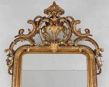 An early 20th century Rococo style mirror.