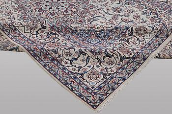 A carpet, Nain, part silk, ca 426 x 309 cm.