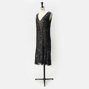 A pearl and sequin embroidered 1920's dress.