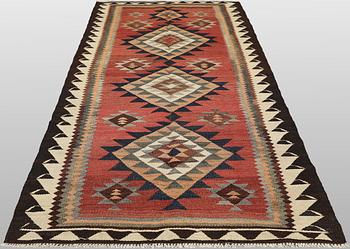 A Nomad Kurdish kilim rug, 270 x 132 cm.