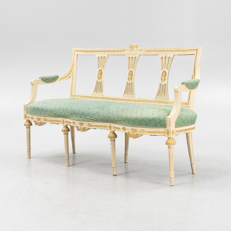 A painted and carved Gustavian style sofa, 1920's.