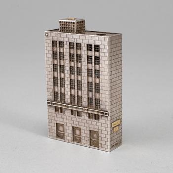 A Tiffany & Co. silver cigarette-lighter, marked London 1970.