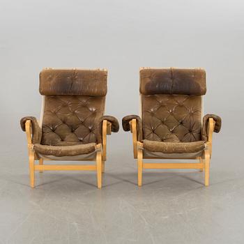 BRUNO MATHSSON, a air of Pernilla armchairs for DUX later part of the 20th century.