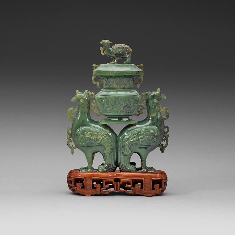 A moss green jade double fenix figurine, 20th century.