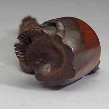 A Japanese bamboo box in the form of a skull with snake, Meiji period (1868-1912).