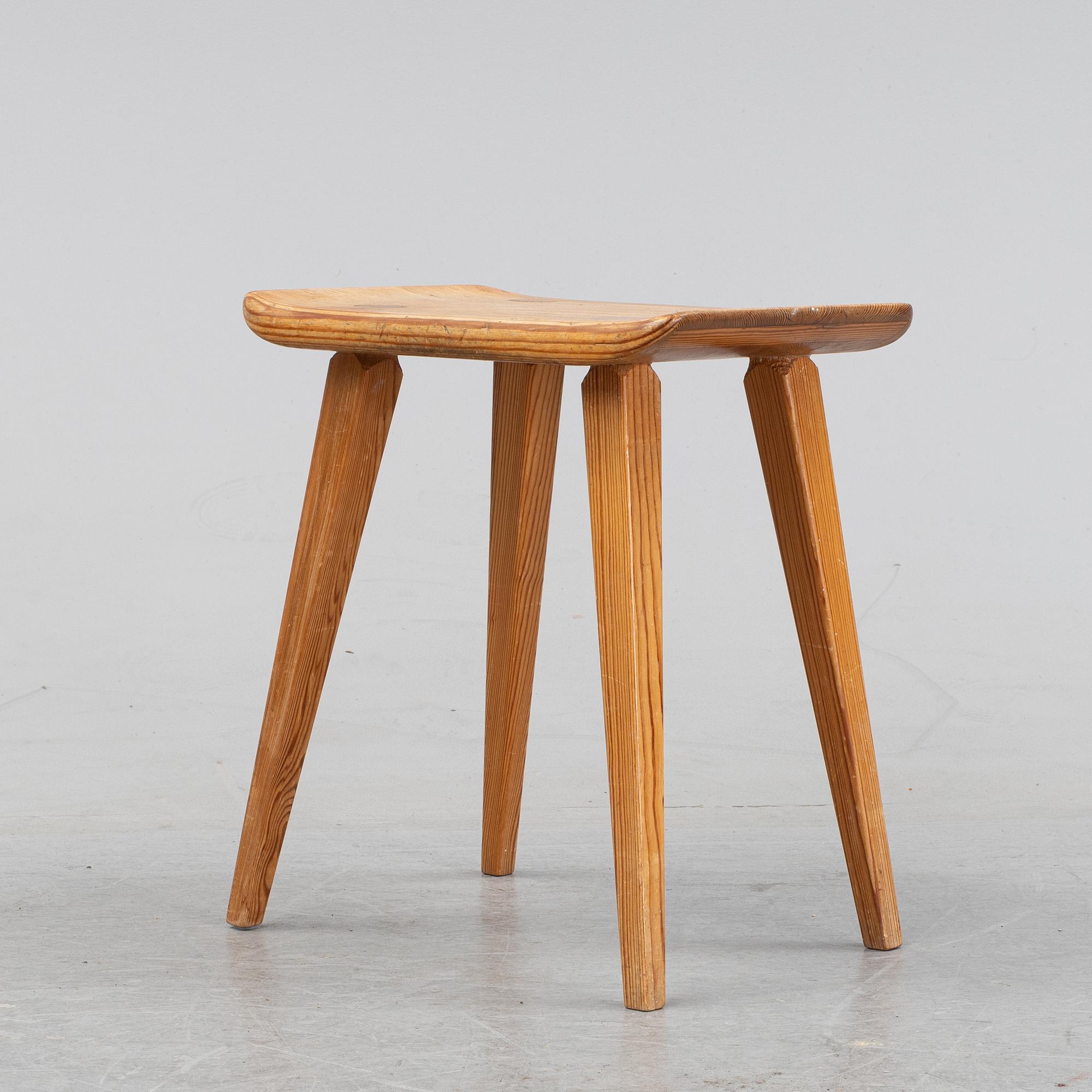 A pine stool by Carl Malmsten for Karl Andersson.
