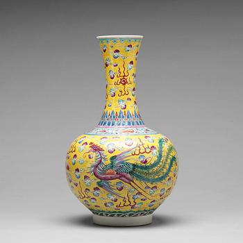 860. A yellow glazed dragon and phoenix vase, China, circa 1900.