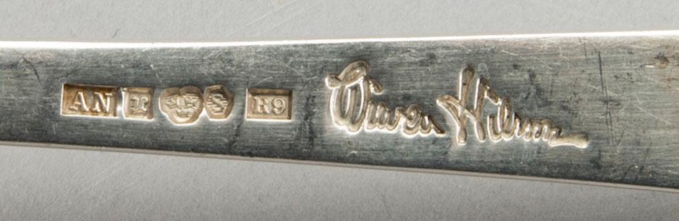 A Swedish 20th century sterling set of three sandwich spoons ad a beaker mark of W Nilsson Lund 1965, 1967 and 1946,