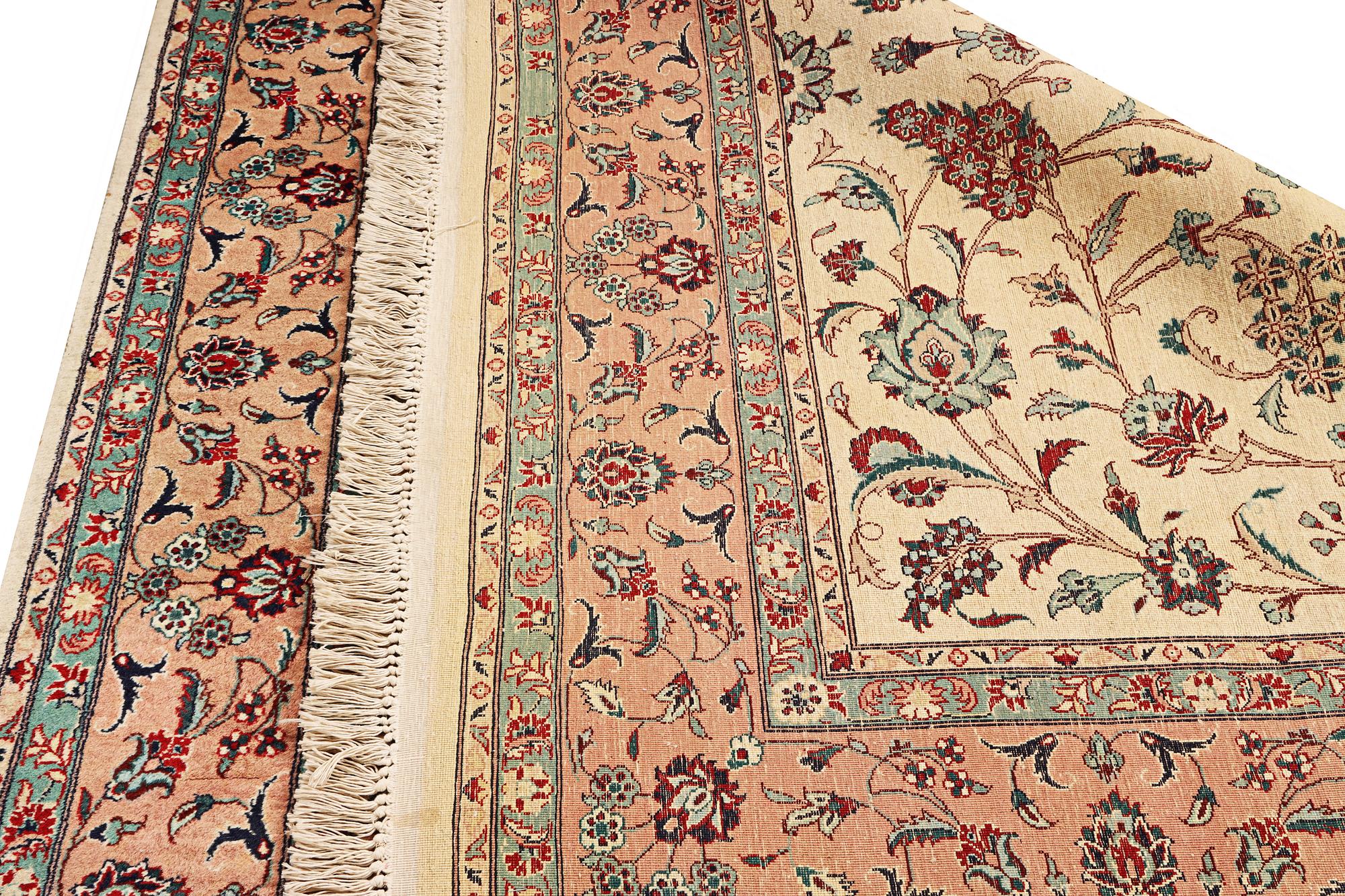 An oriental silk carpet, a. 280 x 185 cm.