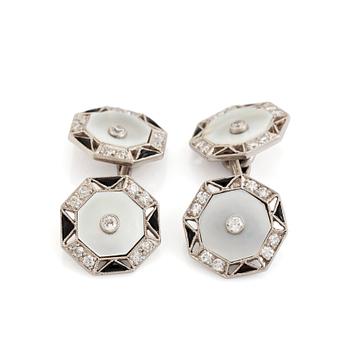 A pair of platinum and mother of pearl cufflinks set with round brilliant- and eight-cut diamonds and onyx.