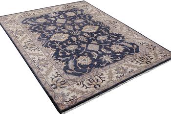 An oriental carpet of Mamluk design, c. 300 x 245 cm.