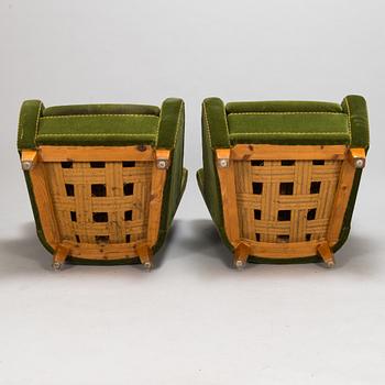 A pair of 1950s armchairs.