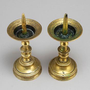 A pair of Baroque 18th century brass candlesticks.