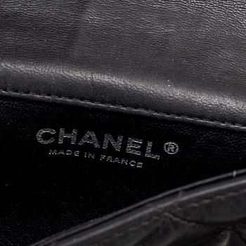 CHANEL, a black leather 'Extra mini flap bag' 2012-13.