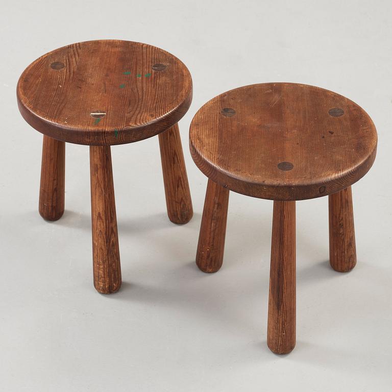 Axel Einar Hjorth, a pair of stained pine 'Utö' stools, Nordiska Kompaniet, Sweden ca 1930.