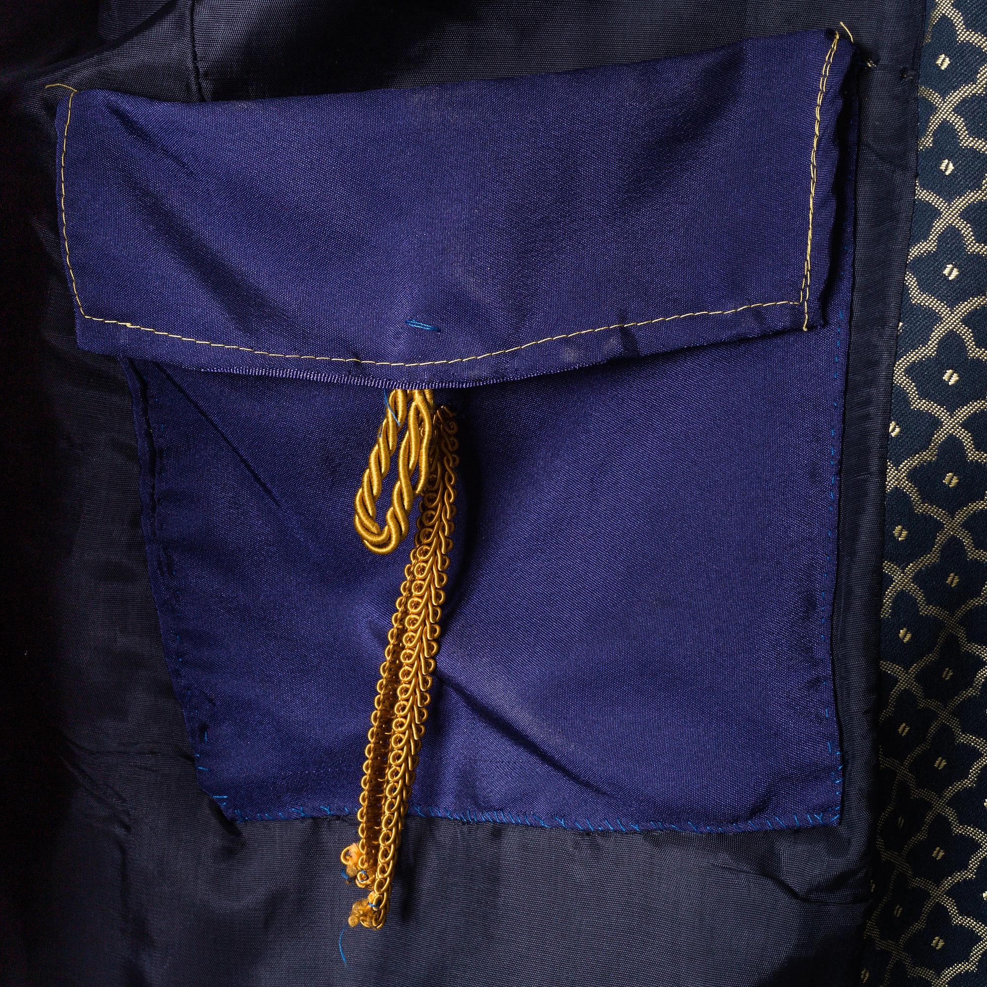 two theater coats from the late 20th century.