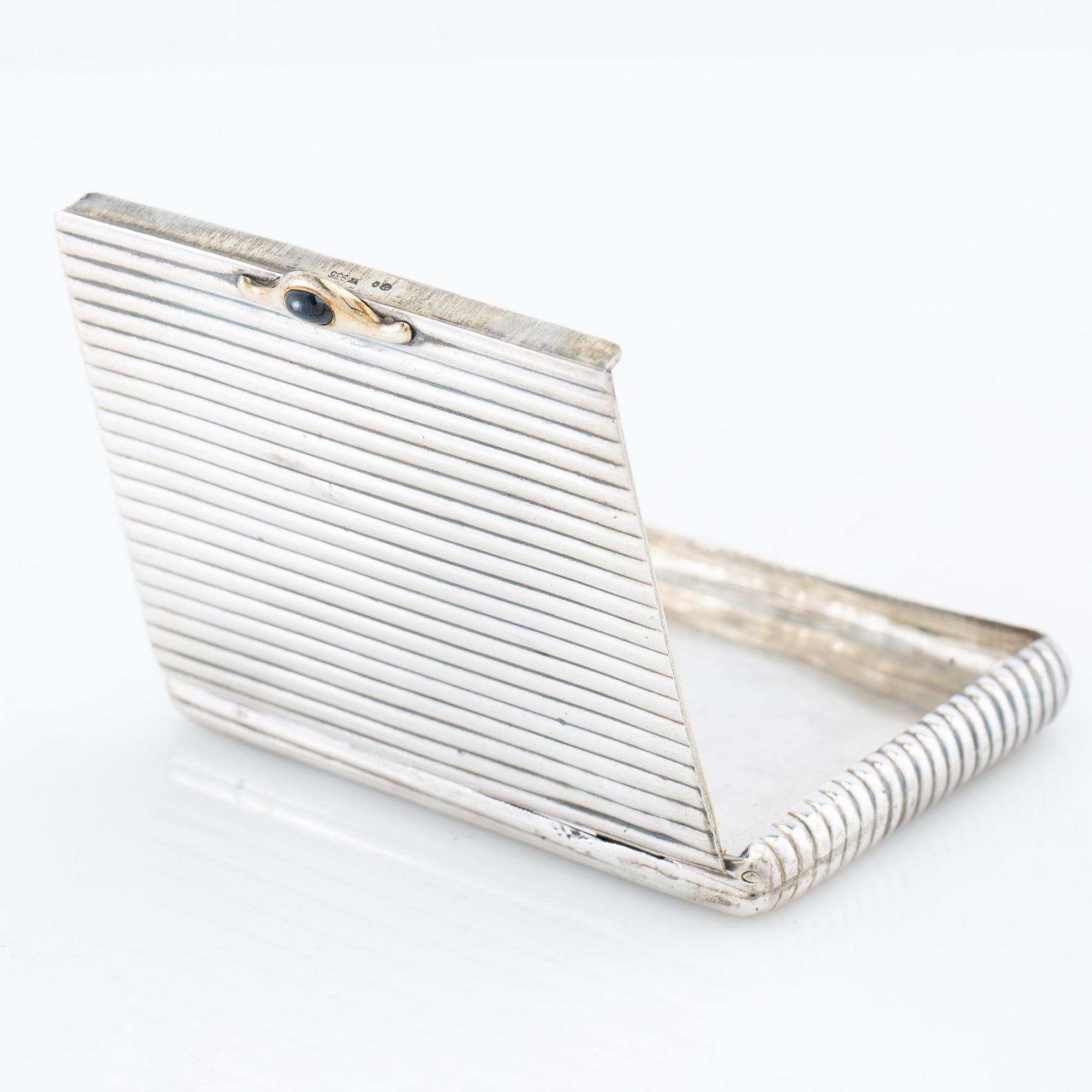 Cigarette case of silver with a cabochon-cut blue stone, first half of the 20th century.