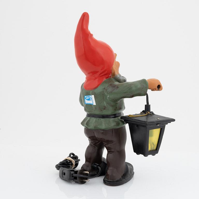 A West German earthenware gnome with lantern from the second half of the 20th century.