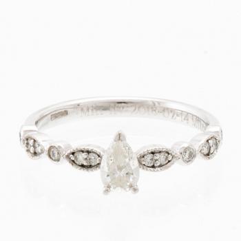 Ring in 18K white gold set with a pear-shaped diamond and round brilliant-cut diamonds, Van Bruun.