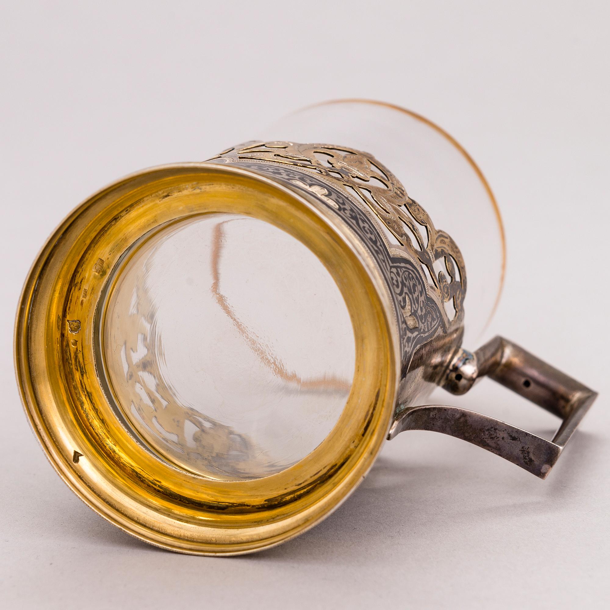 A Russian silver teaglass holder and seven teaspoons, Moscow and Kiev, first half and mid-20th Century.