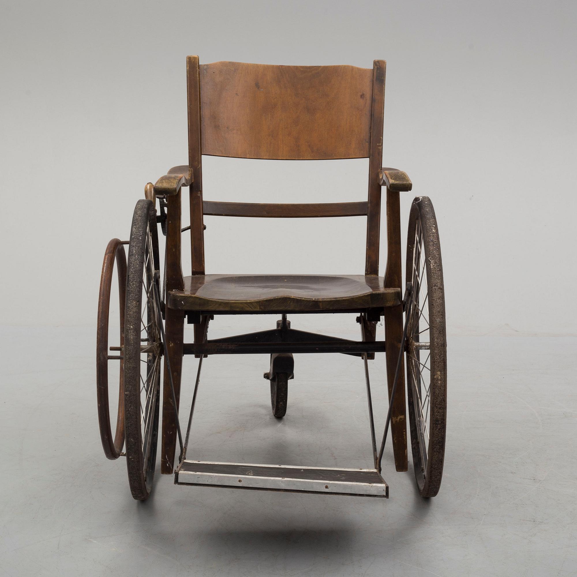 An early 20th century wheel chair.