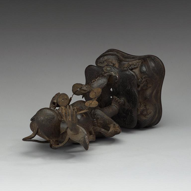 A bronze figure of Liu Hai with money and a three legged toad, Qing dynasty (1644-1912).