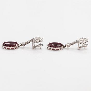 A pair of 18K white gold earrings with rubies ca 20.00 ct in total and diamonds ca 4.28 ct in total. Imort marked Paris.