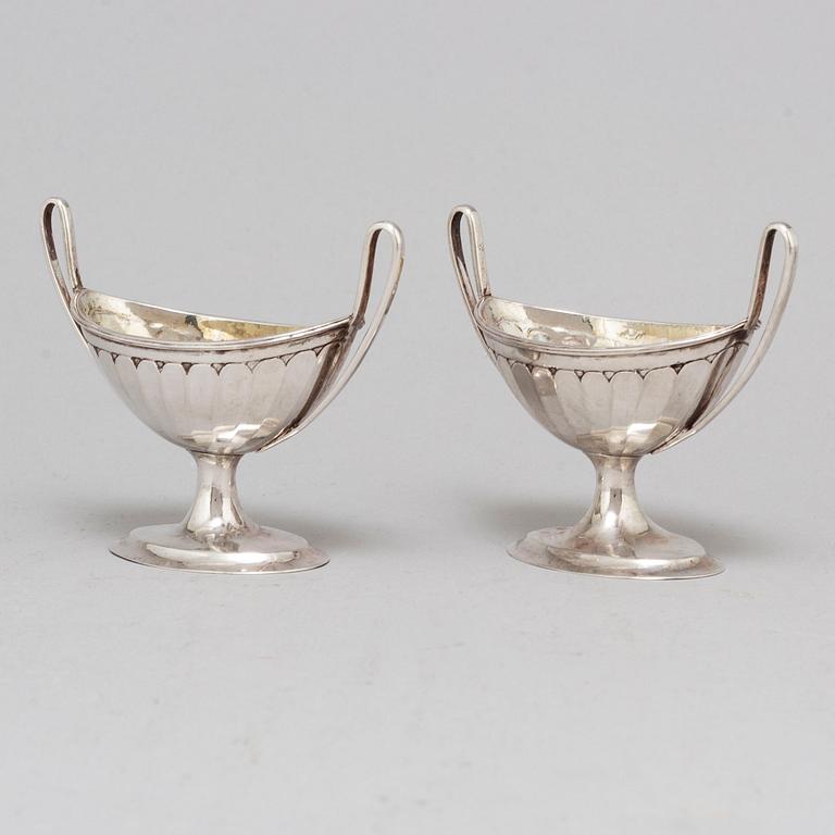 A pair of parcel-gilt empire silver salt cellars, 19th century.